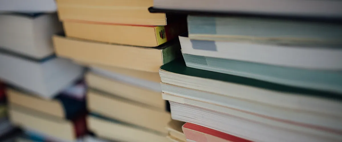 Marvel Encyclopedia New Edition (Hardcover): stock photo (Close-up of stacked books), not the actual product