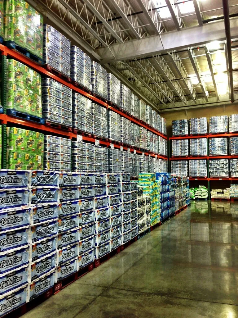 Tall stocked shelves inside a Costco warehouse