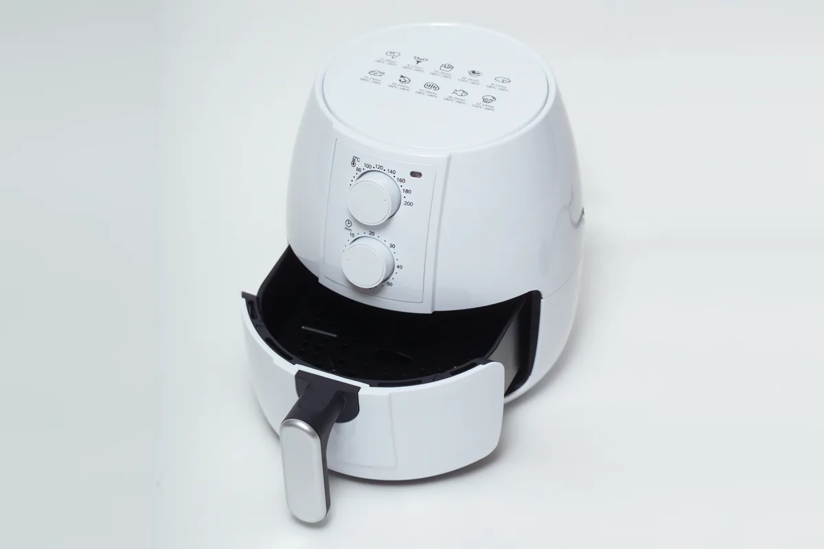 Instant Pot Vortex 5.7QT Air Fryer (Black): stock photo (A generic white basket air fryer with its drawer pulled open), not the actual product