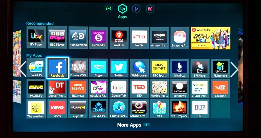 A smart TV home screen showing a grid of streaming and app tiles