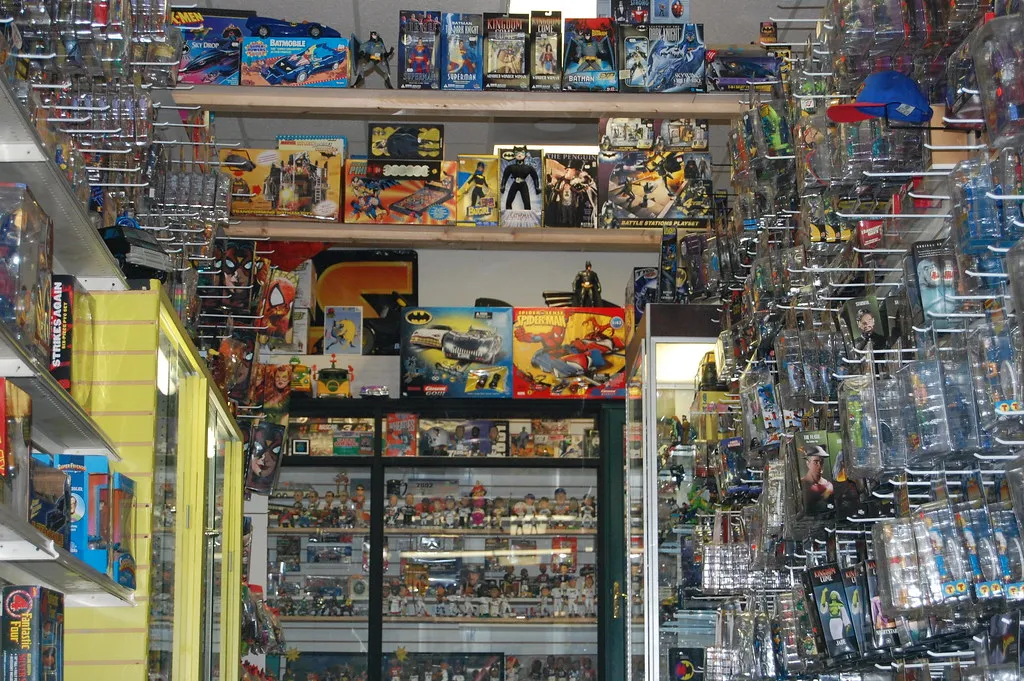 Shelves of boxed action figures and toys in a toy store